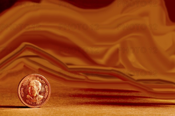 One single Indian currency one rupees coin and artistic background backside embossed Rajiv Gandhi