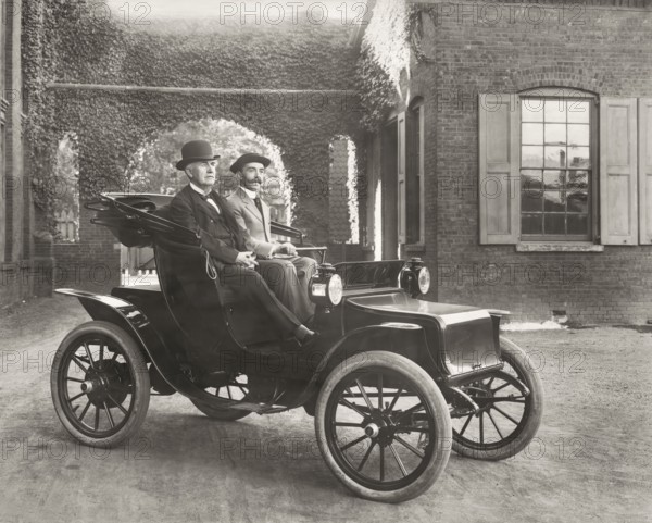 Thomas Edison and Mr. Greenfeldt in a Baker electric automobile, 1910, digitally edited