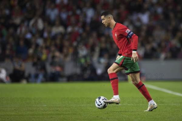 Football match, captain Cristiano RONALDO CR7 Portugal runs with the ball on his left foot to the