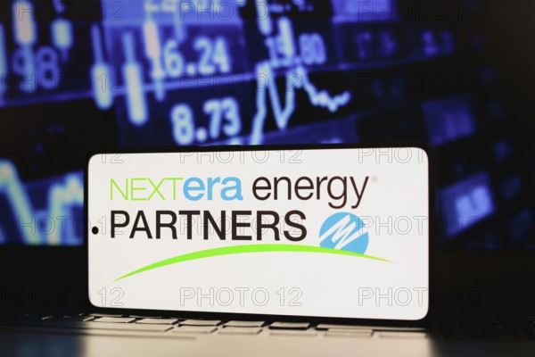In this photo illustration, the NextEra Energy Partners LP logo is displayed on a smartphone screen