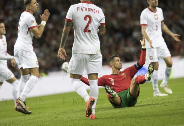Football match, captain Cristiano RONALDO CR7 Portugal centre has just been fouled and is sitting