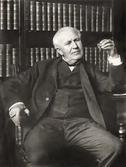 Thomas Alva Edison examining his phonograph recording apparatus, digitally edited
