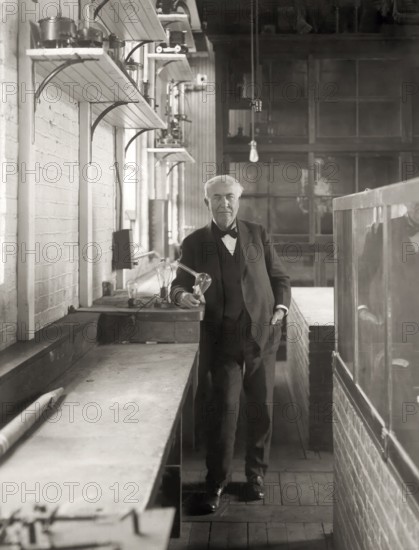 Thomas Alva Edison with his lightbulb, digitally edited