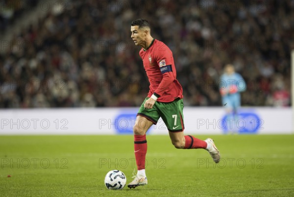 Football match, captain Cristiano RONALDO CR7 Portugal on the ball running towards the left
