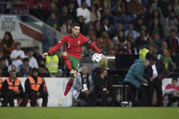 Football match, captain Cristiano RONALDO CR7 Portugal takes the ball in the air with his left foot