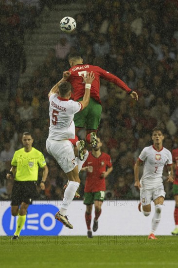 Football match, captain Cristiano RONALDO CR7 Portugal in red heading a ball three times as high as
