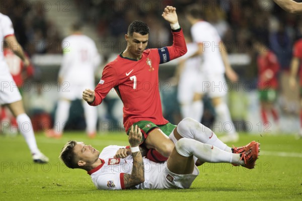 Football match, captain Cristiano RONALDO CR7 Portugal on the stomach and partly on the abdomen of