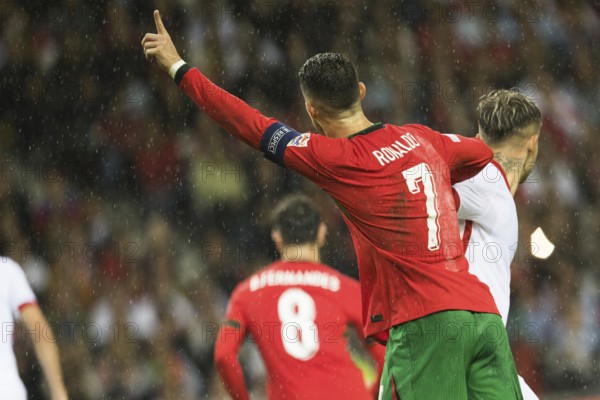 Football match, captain Cristiano RONALDO CR7 Portugal looking from behind in the rain, with
