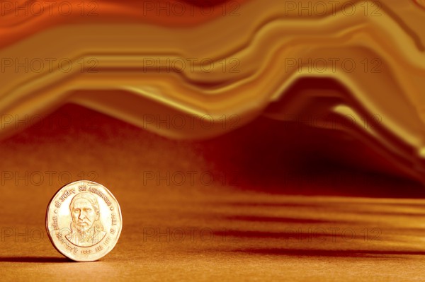 One single Indian currency two rupees coin and artistic background backside embossed Sri Aurbindo