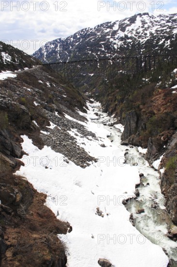 Snow capped mountains, A steel bridge constructed in 1901, tallest cantilever bridge in the world