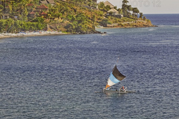 East coast with outrigger sailing boat near Amed, Bali, Indonesia, Asia