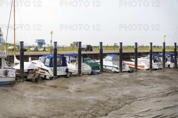 Ships and pleasure boats moored in Sielhafen am Wadden Sea, Wremen, Cuxhaven, Lower Saxony