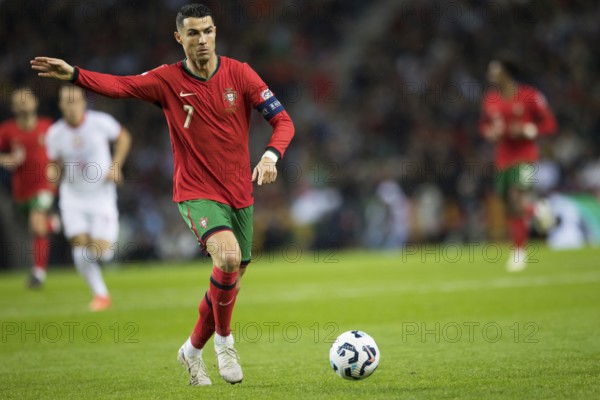 Football match, captain Cristiano RONALDO CR7 Portugal on the ball, captain's armband, left arm