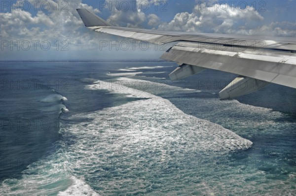 Aerial view of surf, wing with winglet, approach to Denpasar, Bali, Indonesia, Asia