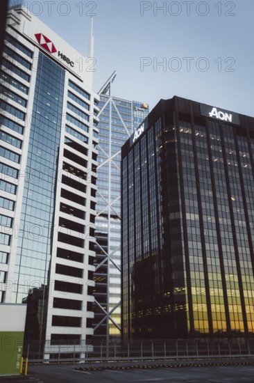 Two modern buildings with the focus on their glass facades at sunset, Auckland, New Zealand,