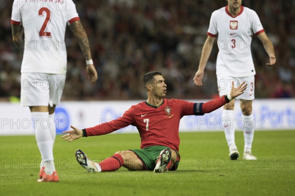 Football match, captain Cristiano RONALDO CR7 Portugal centre has just been fouled and is sitting