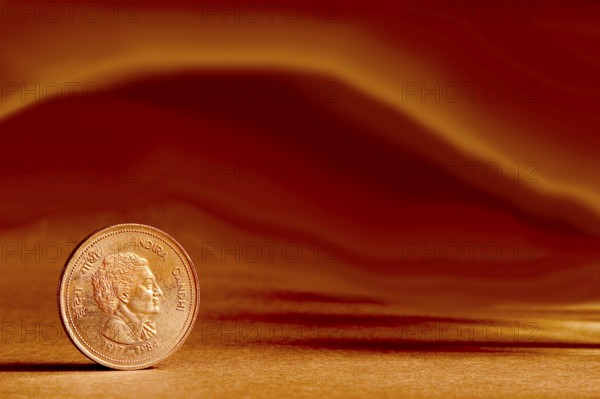 One single Indian currency five rupees coin and artistic background backside embossed Indira Gandhi