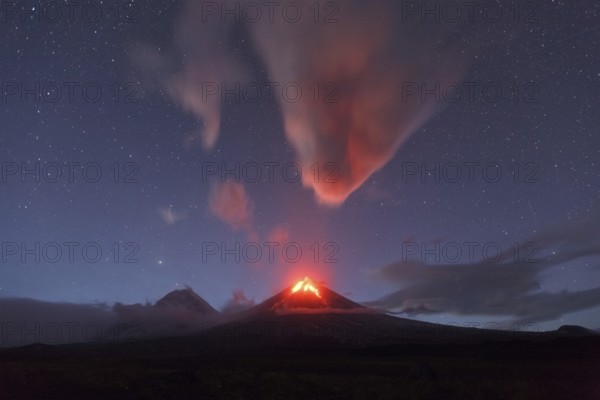 Beautiful volcanic landscape of Kamchatka Peninsula: night view of eruption active Klyuchevskaya