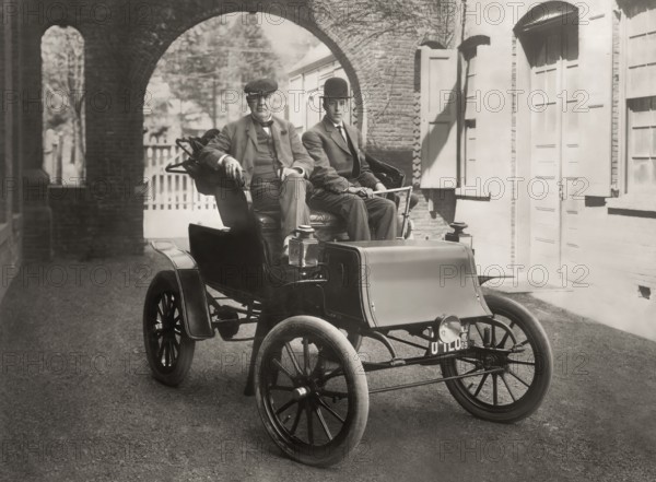 Thomas Edison and Mr. Greenfeldt in a Baker electric automobile, 1910, digitally edited