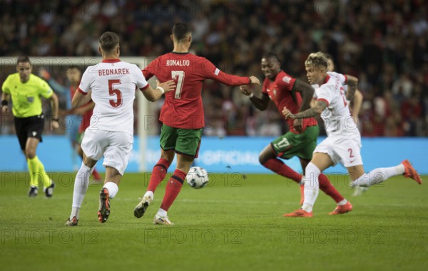 Football match, Cristiano RONALDO CR7 Portugal centre, left Jan BEDNAREK Poland, right Rafael LEAO