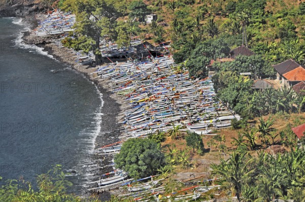 Forested east coast with outrigger boats near Amed, Bali, Indonesia, Asia