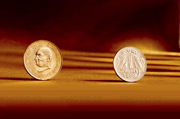 Double pair Indian currency one rupees coin front side and backside manner embossed Mahatma Gandhi