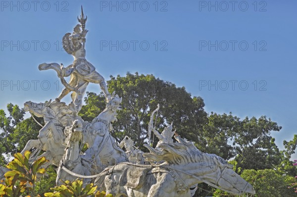 Balinese stone mythology figures on horse statues, Denpasar, Bali, Indonesia, Asia