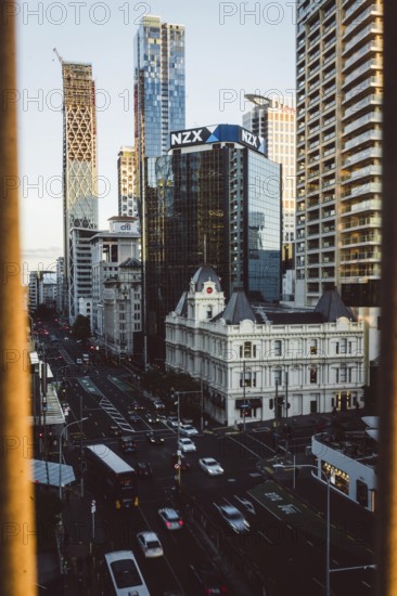 Urban scene with the NZX building and busy streets in the foreground, new zealand stock exchange,
