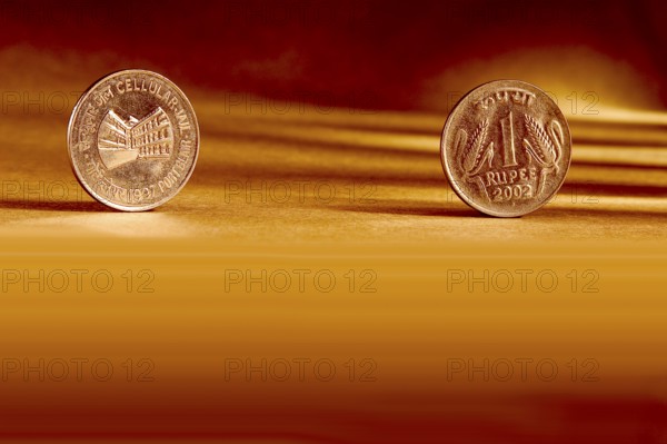 Double pair Indian currency one rupees coin front side and backside manner embossed Cellular Jail