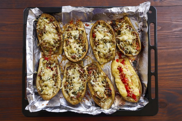 Meat stuffed eggplants recipe on brown wood table