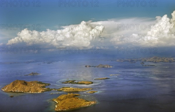 Aerial view, cumulus clouds, cumulus and small islands, flight from Denpasar Bali to Flores,