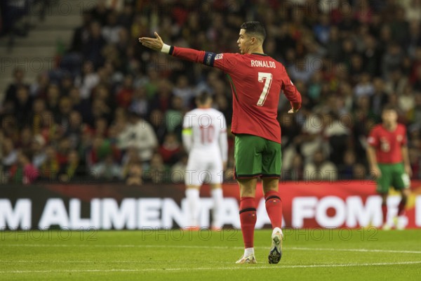 Football match, captain Cristiano RONALDO CR7 Portugal walking to the left with his arm pointing to