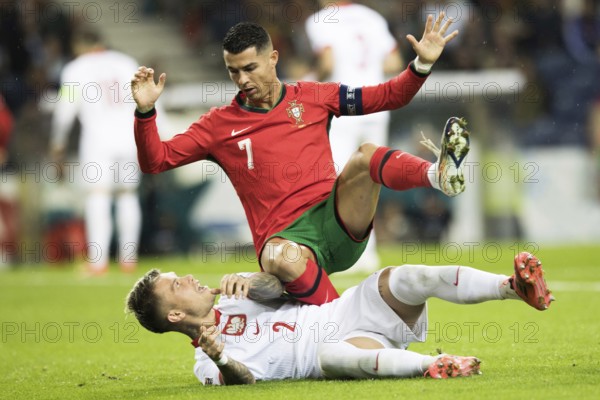 Football match, captain Cristiano RONALDO CR7 Portugal on the stomach of Kamil PIATKOWSKI Poland