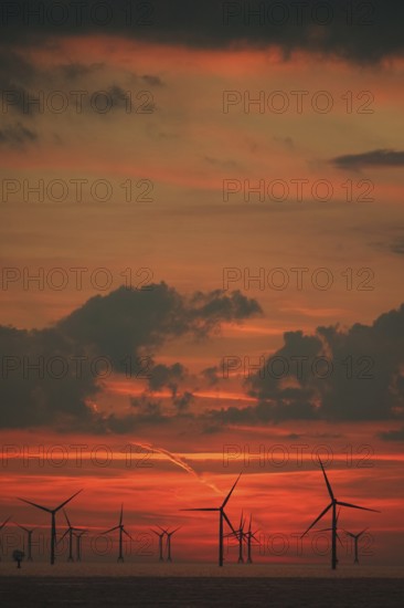 Sky over Baltic Sea wind farm at sunset