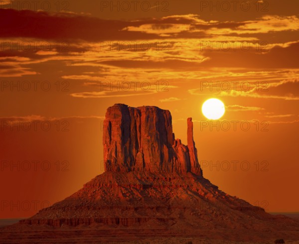 Monument Valley West Mitten at sunrise sun orange sky Utah photo mount