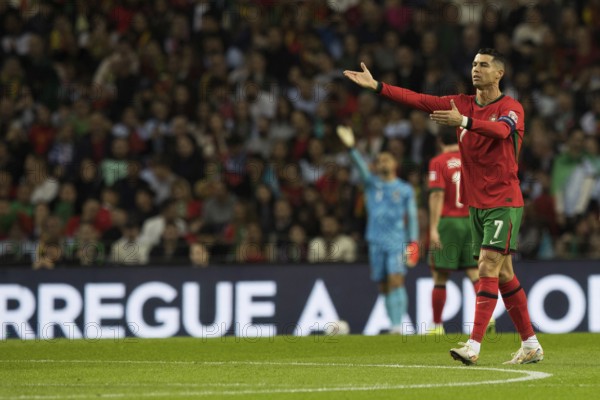 Football match, captain Cristiano RONALDO CR7 Portugal right with both arms pointing up and left