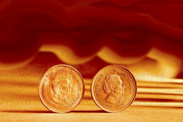 Double pair Indian currency five rupees coin and artistic background backside embossed Jawaharlal
