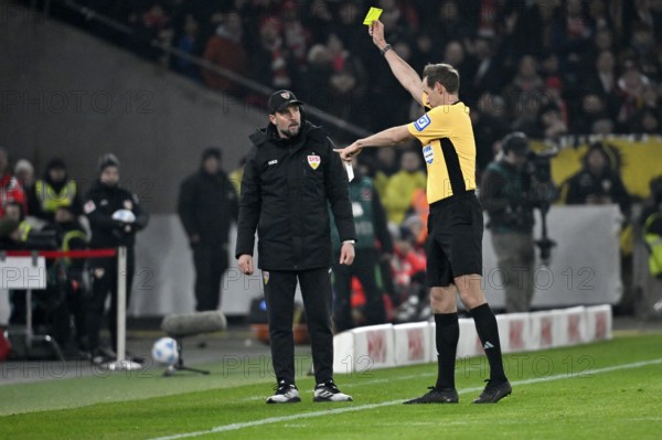 Referee Referee Sascha Stegemann shows coach Sebastian Hoeness VfB Stuttgart yellow card yellow