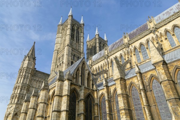 Looking up at west towers of Lincoln cathedral church, city of Lincoln, Lincolnshire, England, UK