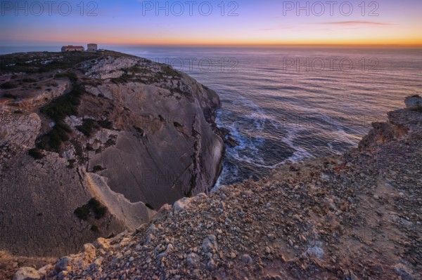 Cabo Espichel cape Espichel on Atlantic ocean at sunset with ruins
