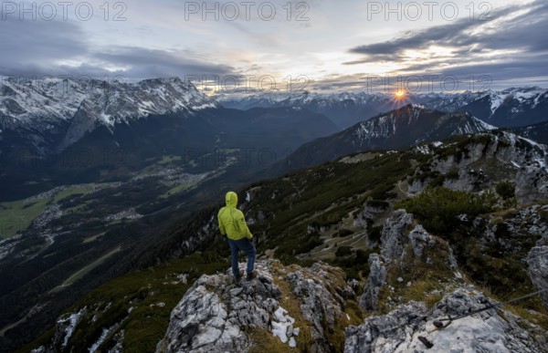 View Mountain panorama with Wetterstein mountains and Zugspitze, at sunset with sun star,