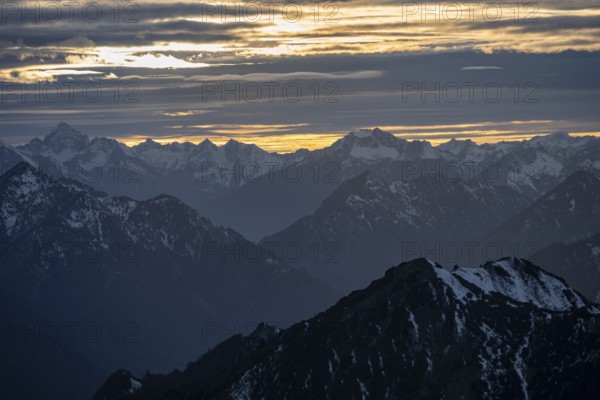 Mountain panorama with snow at sunset, in autumn, view from Kramerspitz, Bavarian Prealps, Bavaria,