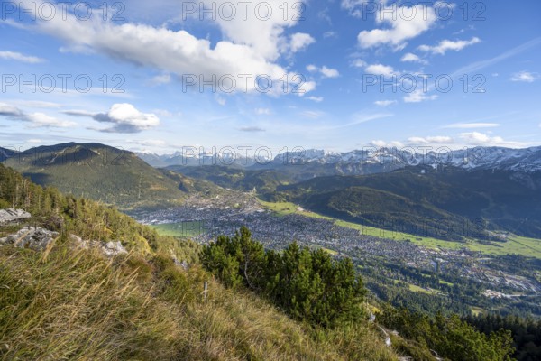 View of Garmisch-Partenkirchen and mountain panorama, hike to Kramerspitz, in autumn, Ammergau