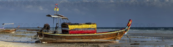 Longtail boat on the beach, at low tide, Koh Ngai Island, Andaman Sea, Satun Province, Southern