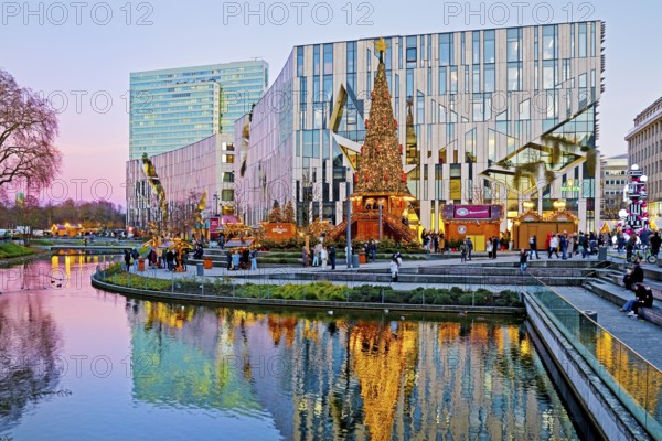 Dreischeibenhaus and Christmas market in front of the Koe-Bogen by architect Daniel Libeskind,