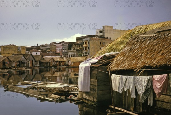 Informal shelters built on logs, known as the floating city, Manaus, Brazil 1962 Building on solid