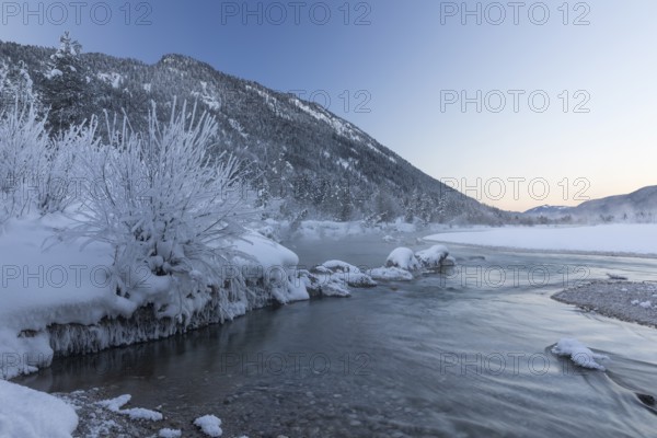 Isar valley in winter at temperatures of minus 18 degrees Celsius. Snow covered landscape with the