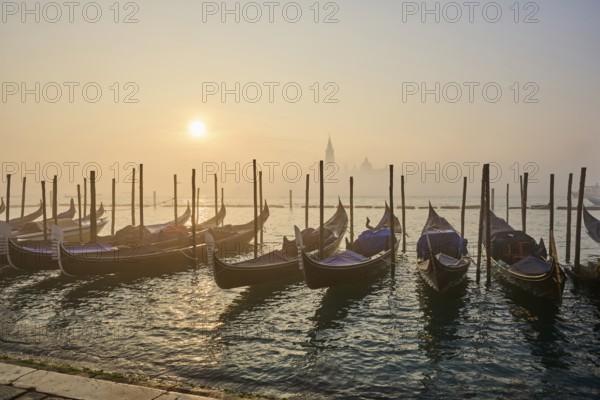 View from 'Colonna di San Marco e San Teodoro' on the gondolas lying in the water with the church