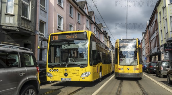 Tram and bus in traffic, on the street Schonnebeckhöfe in Essen-Katernberg, North Rhine-Westphalia,