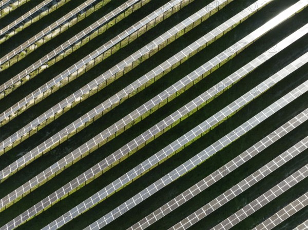Rows of solar panels at a photovoltaic plant near the town of Espejo. Aerial view. Drone shot.